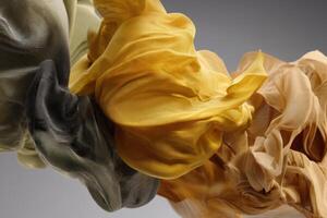 Abstract arrangement of flowing, delicate fabrics in muted tones including gray, mustard yellow, and soft beige, creating a sense of movement and fluidity in an artistic composition photo