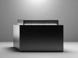 Sleek black geometric cube with a smaller raised section on top, creating a minimalist and modern look, with diffused light highlighting its edges and casting soft shadows photo