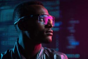 A man wearing futuristic transparent glasses with pink and blue highlights gazes thoughtfully. Background features blurred code, creating a modern, technological atmosphere photo