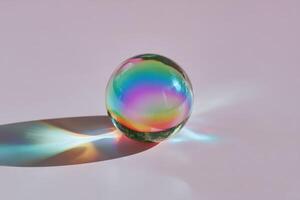 Colorful glass ball casting a rainbow shadow on surface, light reflecting and refracting through the sphere, creating vibrant hues and soft gradients. Artistic and captivating visual effect photo