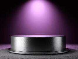 Metallic cylindrical podium under spotlight with a gradient of purple light illuminating from above, creating a dramatic and elegant atmosphere. Textured platform surface reflecting light photo