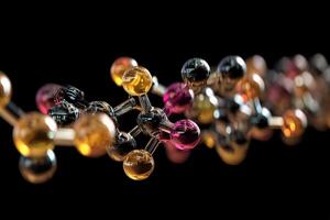 Colorful molecular structure composed of interconnected shiny spheres in various shades, displaying an abstract form, suggesting concepts of science, chemistry, and innovation photo