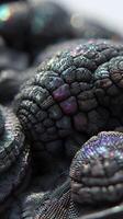 Intricate, abstract close-up of textured, black and metallic spherical forms with iridescent highlights, resembling organic structures or futuristic design elements, no visible text photo