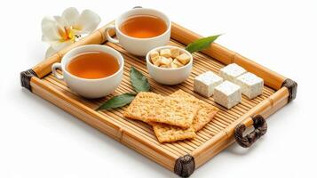 A tray with tea and crackers on it photo