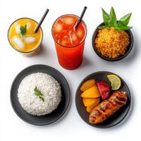 Various types of food including rice, meat, and drinks photo