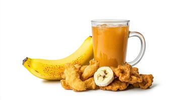 A glass of orange juice next to a banana and fried chicken photo