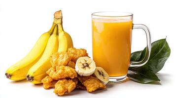 A glass of orange juice next to a banana and some fried chicken photo