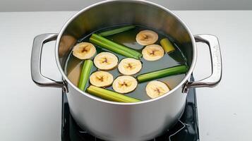 A pot filled with sliced bananas and celery photo