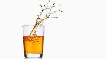 A glass of orange juice with a splash of liquid photo