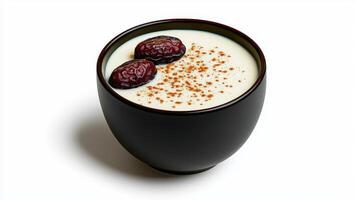 A cup of milk with dates and cinnamon photo