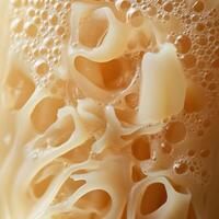 A close up of a piece of cheese with bubbles photo