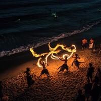 A group of people performing fire dancing on the beach photo