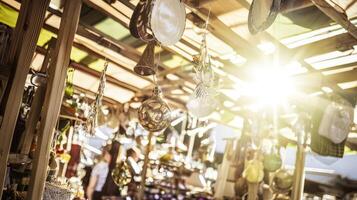A market with lots of items hanging from the ceiling photo