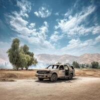 A vehicle is parked in the dirt with trees and mountains in the background photo