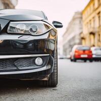 A close up of a black car on the street photo