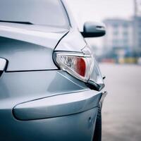 A close up of a car with its tail light on photo