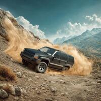 Jeep driving on a dirt road in the mountains photo