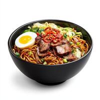 A bowl of noodles with meat and an egg photo