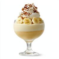 Banana pudding in a glass with whipped cream and bananas photo