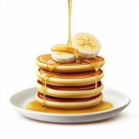 A stack of pancakes with bananas on top photo