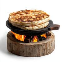 A stack of pancakes on a grill photo