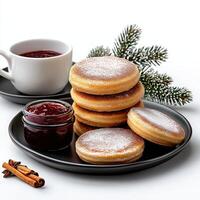 A plate with a stack of pancakes and a cup of coffee photo