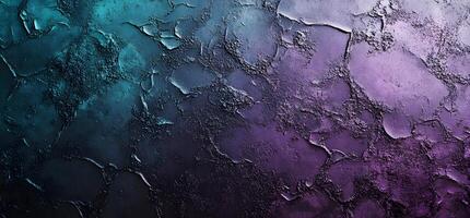 Abstract teal to purple gradient displays a cracked, grainy texture on an uneven surface photo
