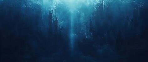 An ethereal light descends through the depths, casting blue shadows in an underwater landscape photo