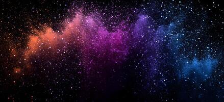 An explosion of colorful powder sprays across the dark background like a sparkling, vibrant nebula photo