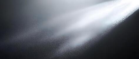 Bright light illuminates through textured fog on a dark surface creating atmospheric contrast photo