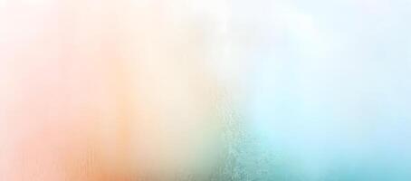 Gradient backdrop features soft transitions between light peach, cream, white, and cool cyan shades photo
