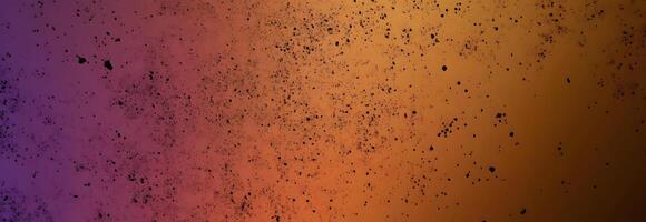 Gradual color shifts from purple to orange with dark speckles create a cosmic background photo