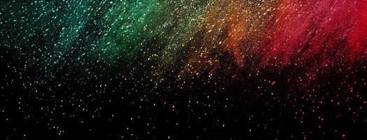 Multicolored powder explosion cascades gracefully against the dark backdrop, creating a vibrant and captivating spectacle photo