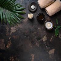 Overhead shot reveals serene spa elements with rolled towels and skincare products on textured surface photo