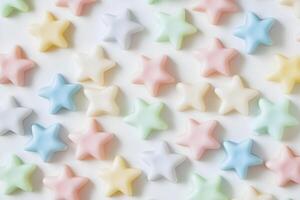 Pastel stars create a whimsical pattern with smooth, soft edges on a white surface photo
