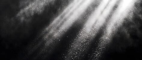 Radiant white dust streams are illuminating the dark background in a magical display photo