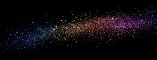 Rainbow glitter particles diagonally spread across a black background create a magical and colorful effect photo