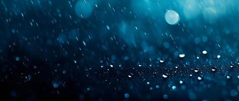 Raindrops and streaks falling on a dark surface create a mesmerizing and refreshing scene photo