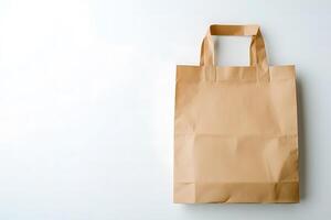 Simple brown paper bag stands against a clean white background, awaiting reuse photo