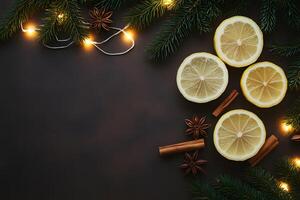 Sliced lemons, anise stars, cinnamon sticks, and pine with festive lights adorn dark surface photo