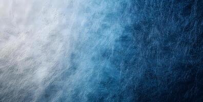 Smooth transition from frosted white to deep blue creates a textured gradient background photo