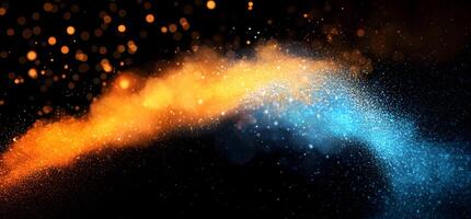 Sparkling golden and blue particles collide elegantly against the dark backdrop, creating an ethereal effect photo