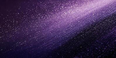 Sparkling violet particles cascade downwards across a deep purple and black gradient background photo
