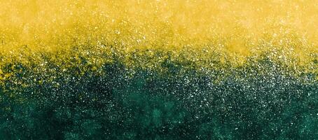 Splattered white dots create a transition from golden yellow to deep green background photo