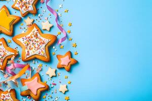 Starshaped cookies with colorful icing and ribbons border a light blue background, inviting festive celebration photo
