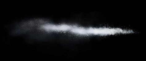 Stream of white powder elegantly dances across a stark black backdrop, showcasing transparency photo