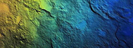 The textured surface transitions smoothly from yellow to blue with detailed, rough edges photo