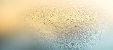Tiny water droplets cling tightly to a golden gradient surface, a moistureladen spectacle photo
