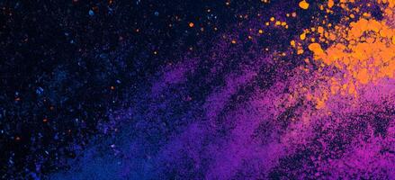 Vibrant orange and purple powder explodes across a dark backdrop creating an eyecatching texture photo
