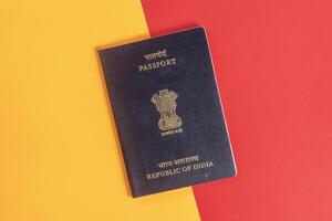 Indian passport on a bright red and yellow background photo